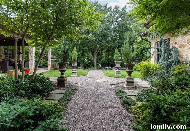 The luxurious media room at 5019 Shadywood Lane, complete with an illuminated mural ceiling and a wet bar, perfect for home entertainment.