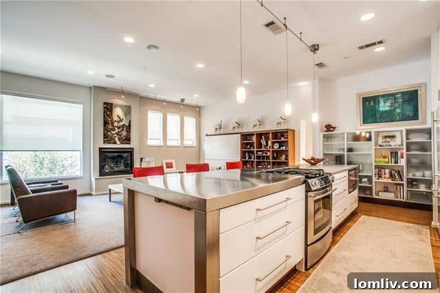 Spacious Living Area with Hardwood Floors and Natural Light