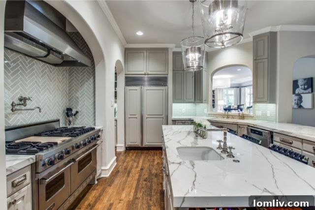Luxurious bathroom with dual vanities, Waterworks fixtures, and designer tile
