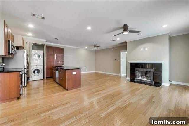 Spacious kitchen with granite countertops in a Cole Avenue condo