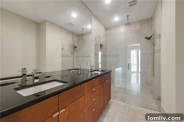 Bedroom with large walk-in closet in a top-floor Uptown condo