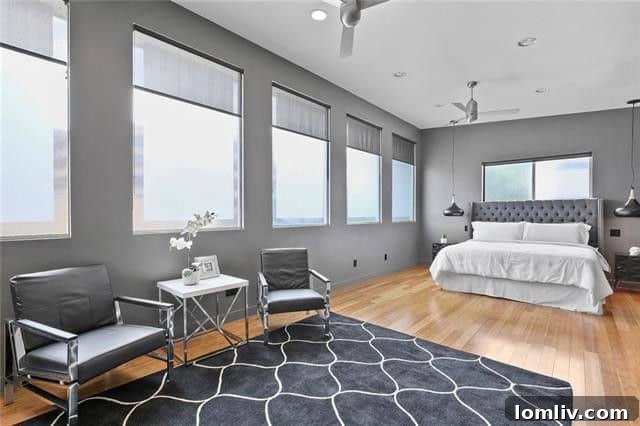 Open concept living area with large windows and natural light