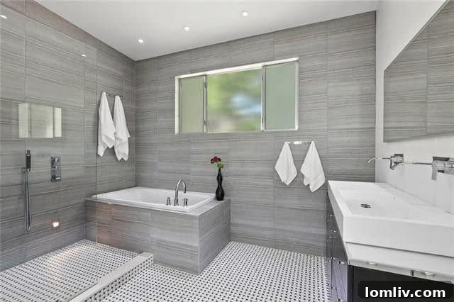 Luxurious master bathroom with soaking tub and frameless glass shower