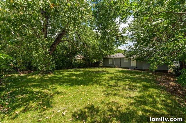 Top-Rated Gonzalez Elementary Zone: Renovated & Affordable Family Home 6 Another perspective of the home's exterior and side yard