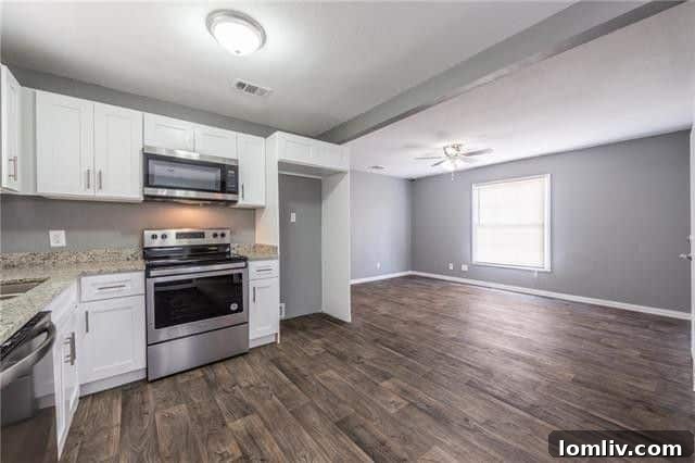 Top-Rated Gonzalez Elementary Zone: Renovated & Affordable Family Home 7 Modern open-concept kitchen with stainless steel appliances