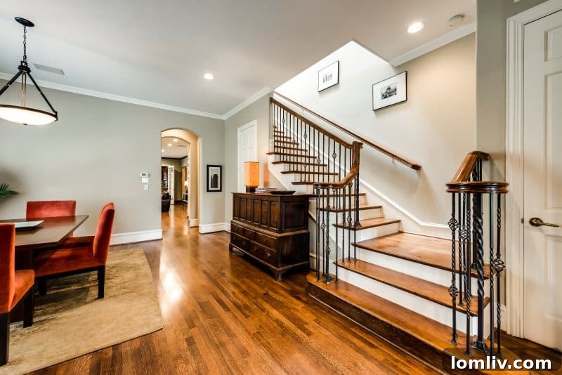 Spacious living room at 3456 Granada Avenue featuring a white marble fireplace and shining hardwood floors