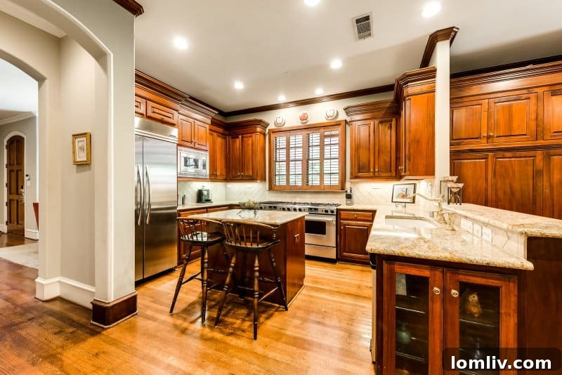 Open concept dining area with an exquisite iron chandelier, perfect for entertaining
