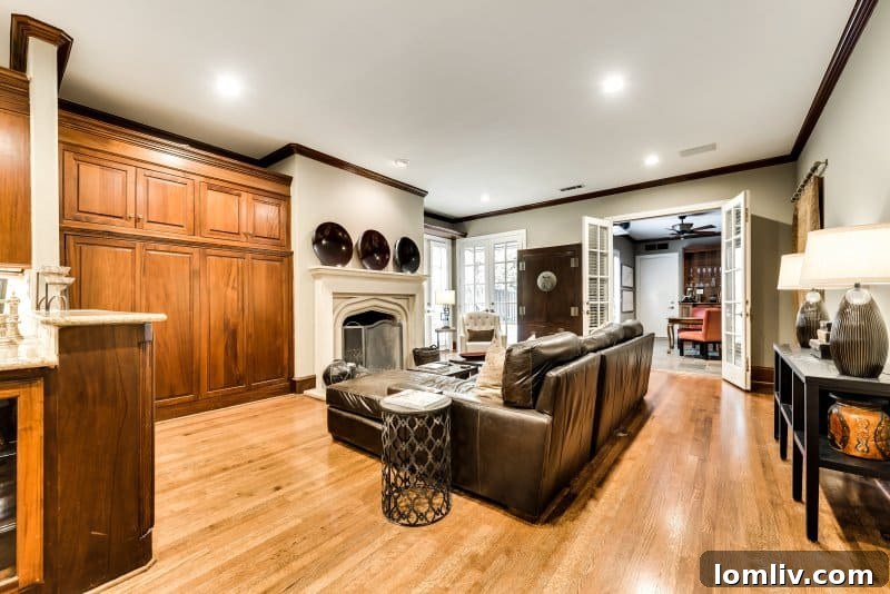 Gourmet chef's kitchen featuring a spacious granite island, mahogany cabinetry, and top-tier stainless steel appliances