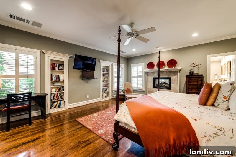 Luxurious master en-suite bathroom featuring a marble bath, dual vanities, and a separate double shower
