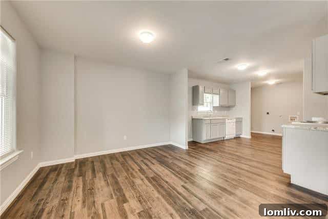 South Oak Cliff High's Popularity Surge: Ushering in a New Era of Success 5 Spacious living room and kitchen area of 4205 Cardinal Drive, open concept living in Oak Cliff