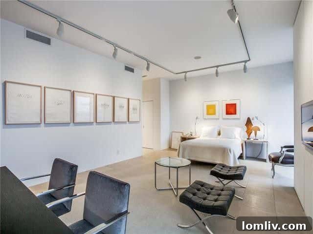 Gold Crest Studio: Your Architectural Sanctuary 4 Spacious living area with modern furnishings and art, showcasing gallery-like walls