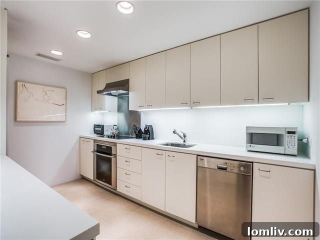 Gold Crest Studio: Your Architectural Sanctuary 6 Modern kitchen with sleek design, integrated appliances, and ample counter space