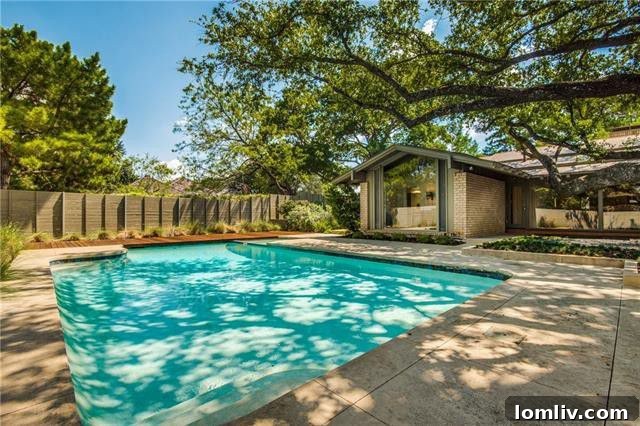 Master bedroom suite with a charming fireplace and ample natural light