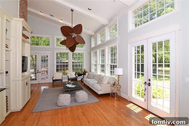 Expansive green lawn and mature trees on the nearly acre lot