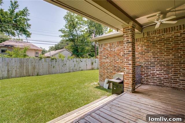 Private fenced backyard with a spacious covered patio, ideal for outdoor gatherings