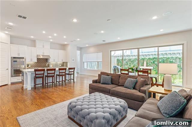 Modern bathroom with double vanity and elegant finishes in Penrose Avenue home