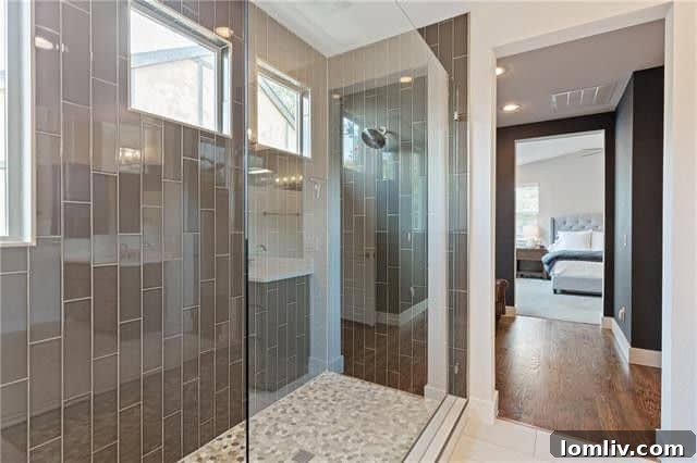 Expansive private fenced backyard with a patio, ideal for outdoor relaxation and entertaining