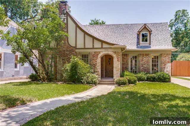 Elegant brick Tudor home exterior with mature landscaping on Monticello Avenue, Dallas
