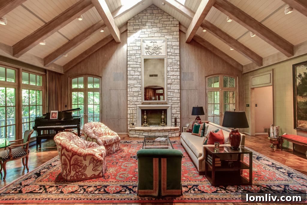 Interior view of 700 Sunrise Court featuring abundant natural light and expansive windows overlooking the balcony and lush grounds