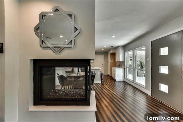 Cozy living area with a gas peninsula fireplace in a modern Dallas home