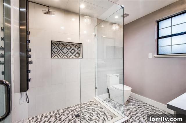 Luxurious first-floor master bathroom with dual sinks and steam shower