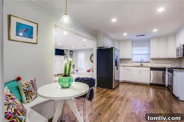 Spacious den with built-in shelving, offering a comfortable and organized living space in the renovated ranch.