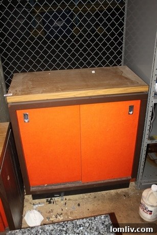 Orange wood-top work cabinet with two sliding doors