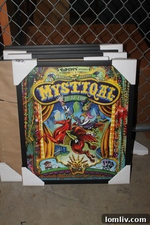 Close-up of assorted items at the Dallas Morning News auction, including a Mystiqal poster