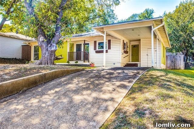 Vibrant Yellow Exterior of 961 Peavy Road Home