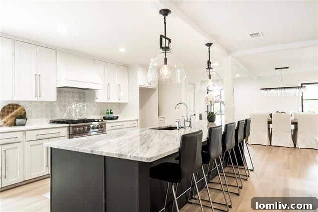 Gourmet kitchen with quartzite island in Dallas home