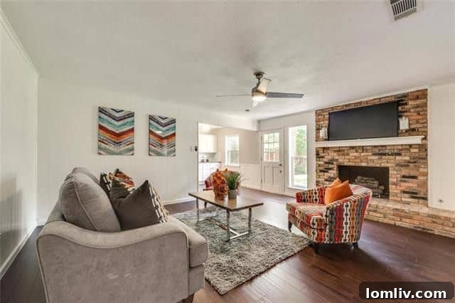 Cozy living room with brick fireplace in Dallas home