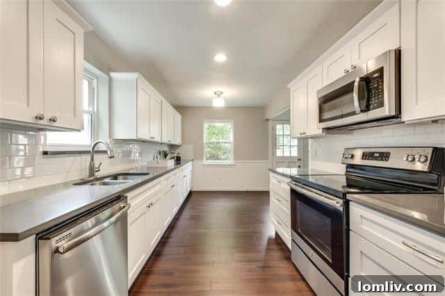 Modern kitchen with quartz counters and subway tile