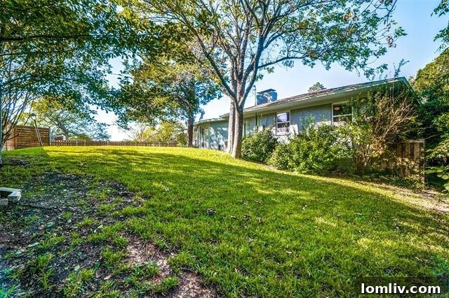 Pergola-covered patio offering outdoor relaxation and entertainment space