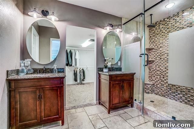 Spacious master bedroom with wood plank floors and natural light