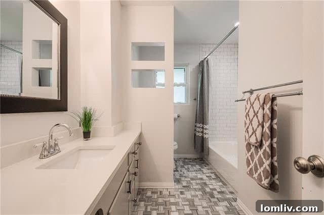 Modern bathroom with unique tile patterns and decorative cutouts