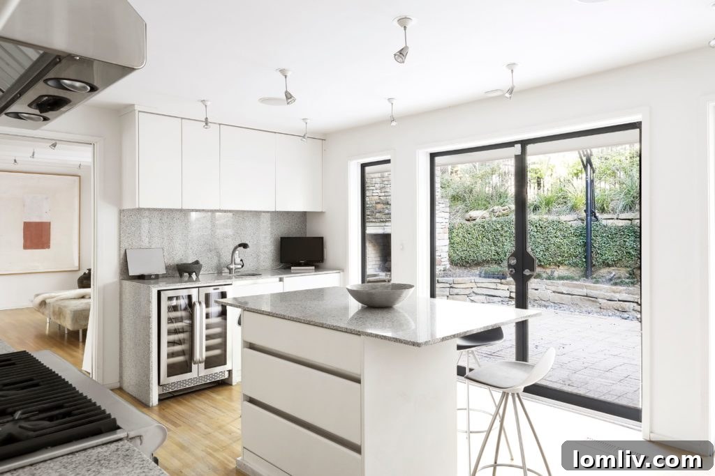 Spacious living area with art collection and natural light