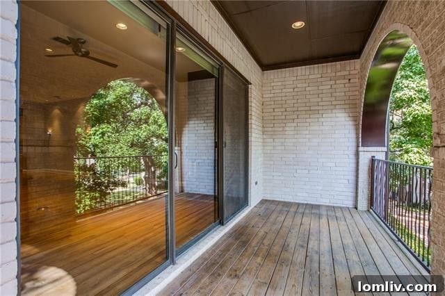 Covered balcony overlooking a community pool in an Uptown Dallas condominium