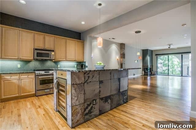 Spacious dining area in a luxury condo with contemporary lighting