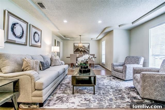 Updated kitchen with quartz countertops and new appliances in a Richardson remodeled home