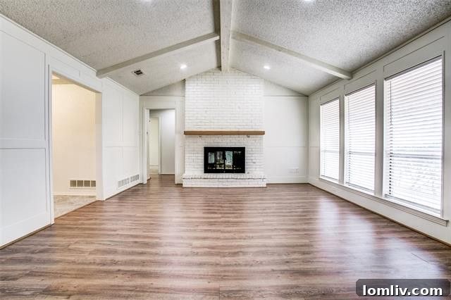 Living room featuring scalloped tray ceiling in a updated Richardson home