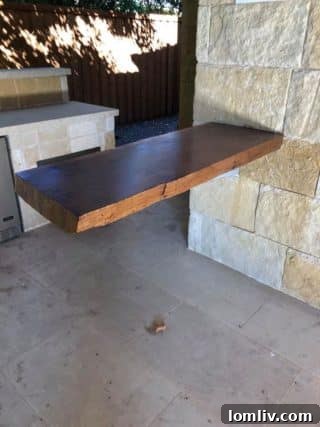 Previous Sale Item: Raw Edge Bar, perfect for a rustic or modern space, salvaged at DFW Pre-Demolition Sale.