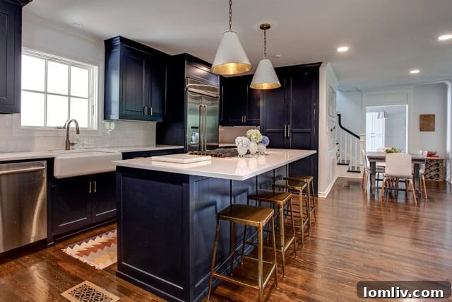 Stylish kitchen at 3720 Hamilton Avenue featuring a striking blue island, a popular trend in contemporary kitchen design.