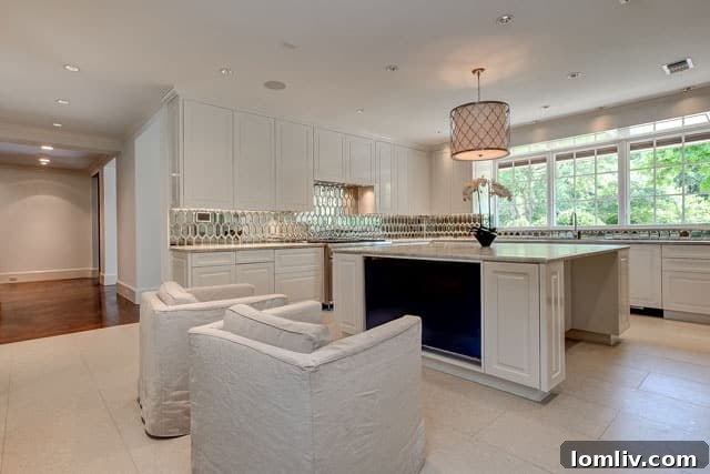 Luxurious and functional kitchen at 6001 Indian Creek Court, featuring an exquisite design and an integrated TV within the island.