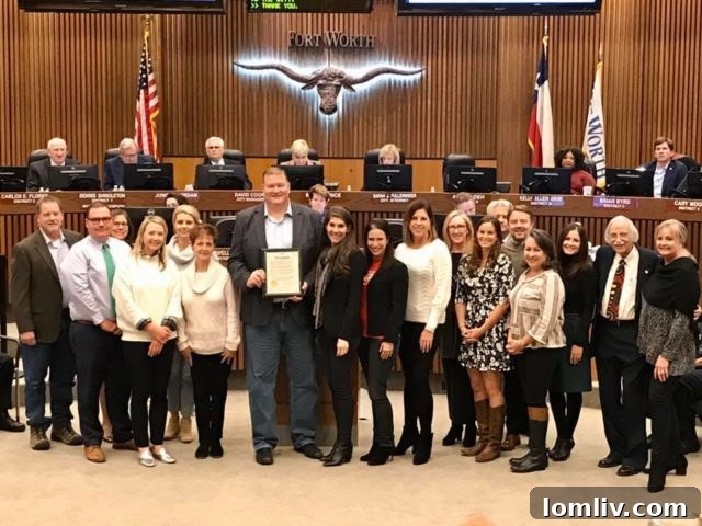 Ryan Place Improvement Association President Tim Keith holding a Fort Worth Proclamation