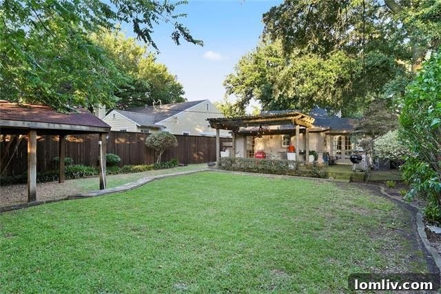 Tasteful Traditional backyard with pergola