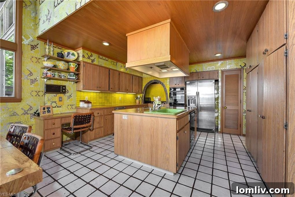 Vintage Kitchen with Bold Yellow Floral Wallpaper and Retro Cabinetry