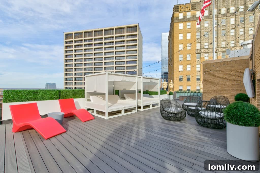 Expansive 6,000 sq ft penthouse deck with panoramic views of Downtown Fort Worth skyline, perfect for luxury entertaining.