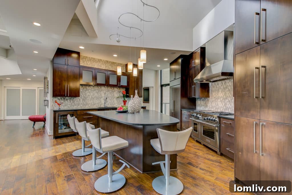 State-of-the-art luxury kitchen in Fort Worth penthouse, designed with strategic angles to maximize light and space.