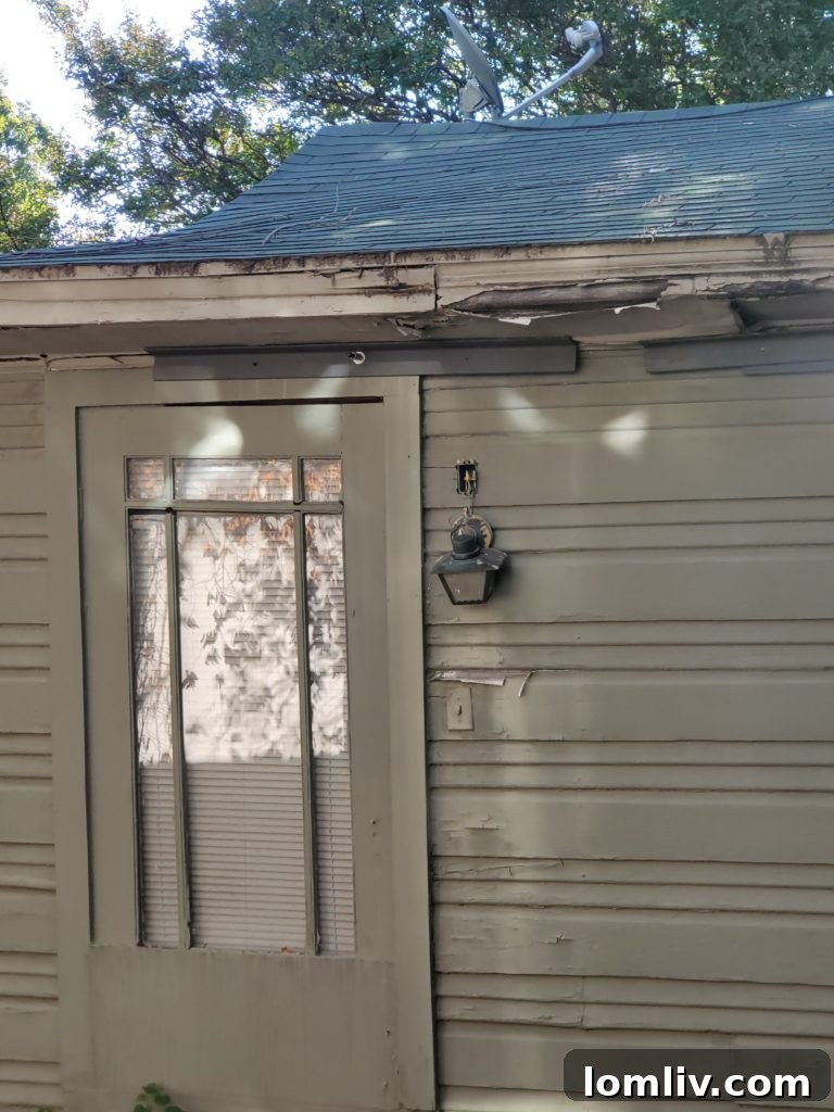 Critically damaged roof with temporary 2x2 wood supports, illustrating unsafe and insufficient roof repairs.