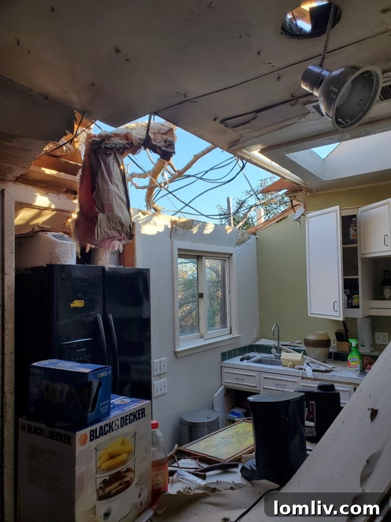 Extensive roof and structural damage on a residential home following a tornado, emphasizing post-disaster home inspection needs.